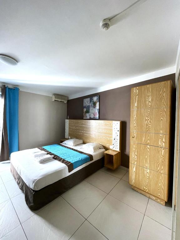 Postel nebo postele na pokoji v ubytování Hôtel Select - Réunion