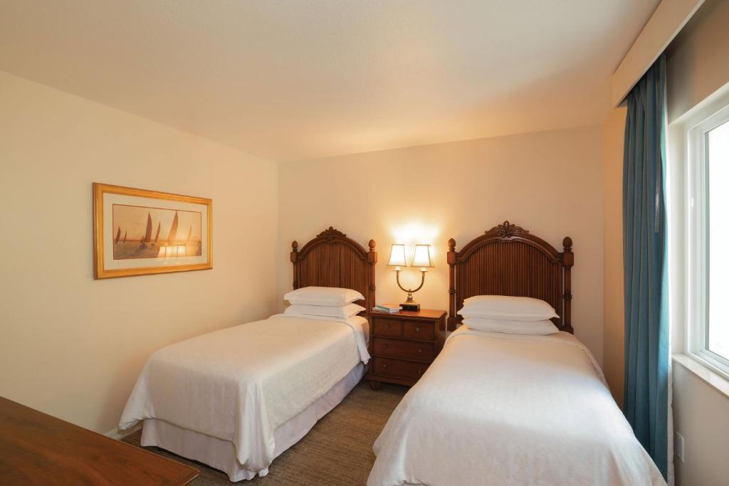 Postel nebo postele na pokoji v ubytování Sheraton Vistana Resort Villas, Lake Buena Vista Orlando