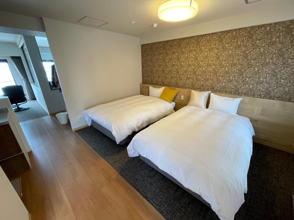 Postel nebo postele na pokoji v ubytování Grandview Atami Private Hot Spring Condominium Hotel