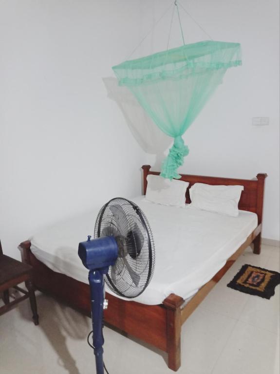 Postel nebo postele na pokoji v ubytování SK HOUSE RESORT UNAWATUNA