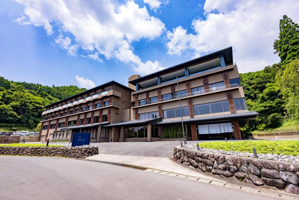 a building with a road in front of it at Urari Takeo Garden Terrace Spa Resorts in Takeo