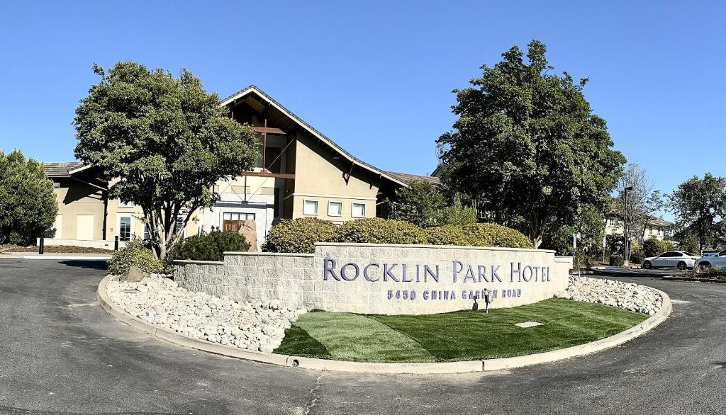a rockin park hotel sign in front of a house at Rocklin Park Hotel in Rocklin