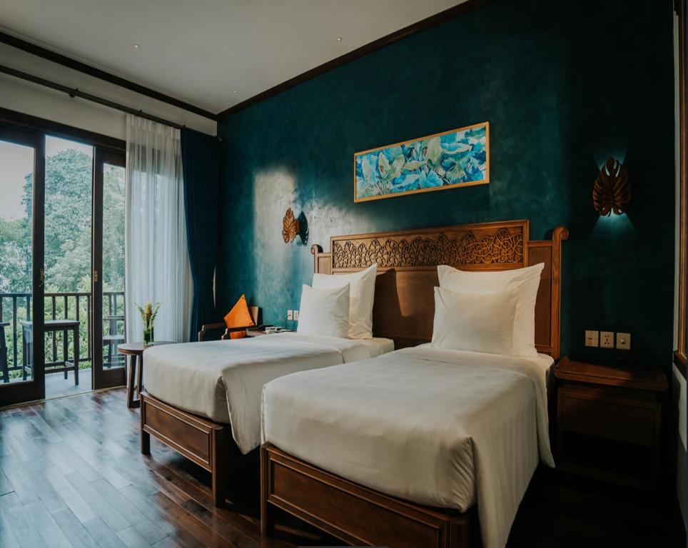 Postel nebo postele na pokoji v ubytování Amour Resort Bavi