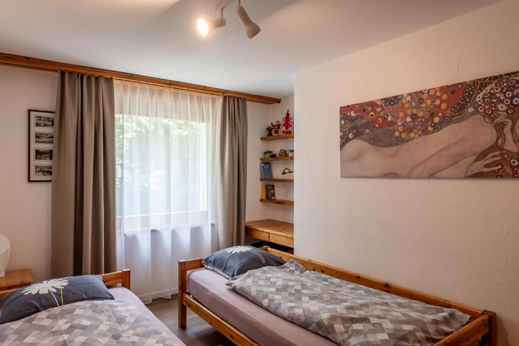 Postel nebo postele na pokoji v ubytování Chalet Belmont
