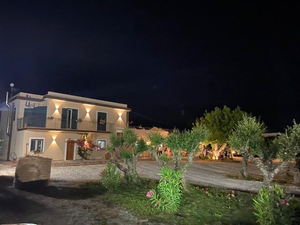 a house at night with trees and lights at B&B Tenuta San Michele in Capaccio-Paestum