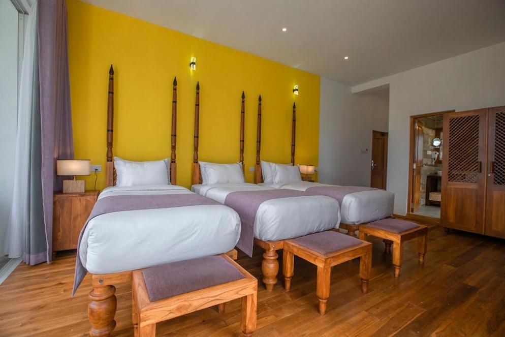Postel nebo postele na pokoji v ubytování Morning Dew Boutique Hotel Ella