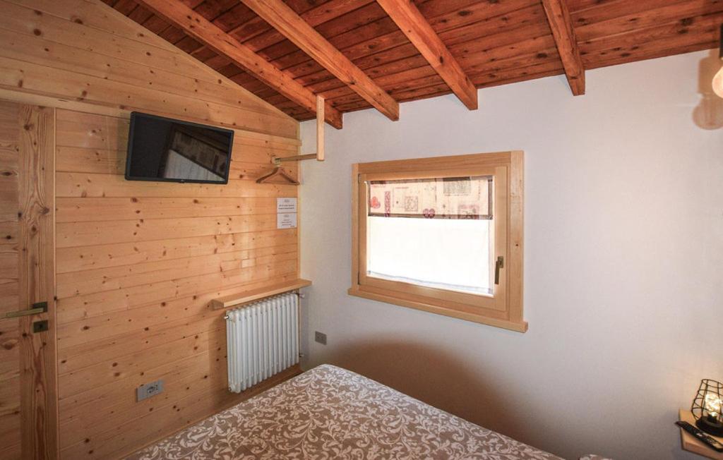 Kama o mga kama sa kuwarto sa CHALET SIMONETTA - Locanda da Tullio