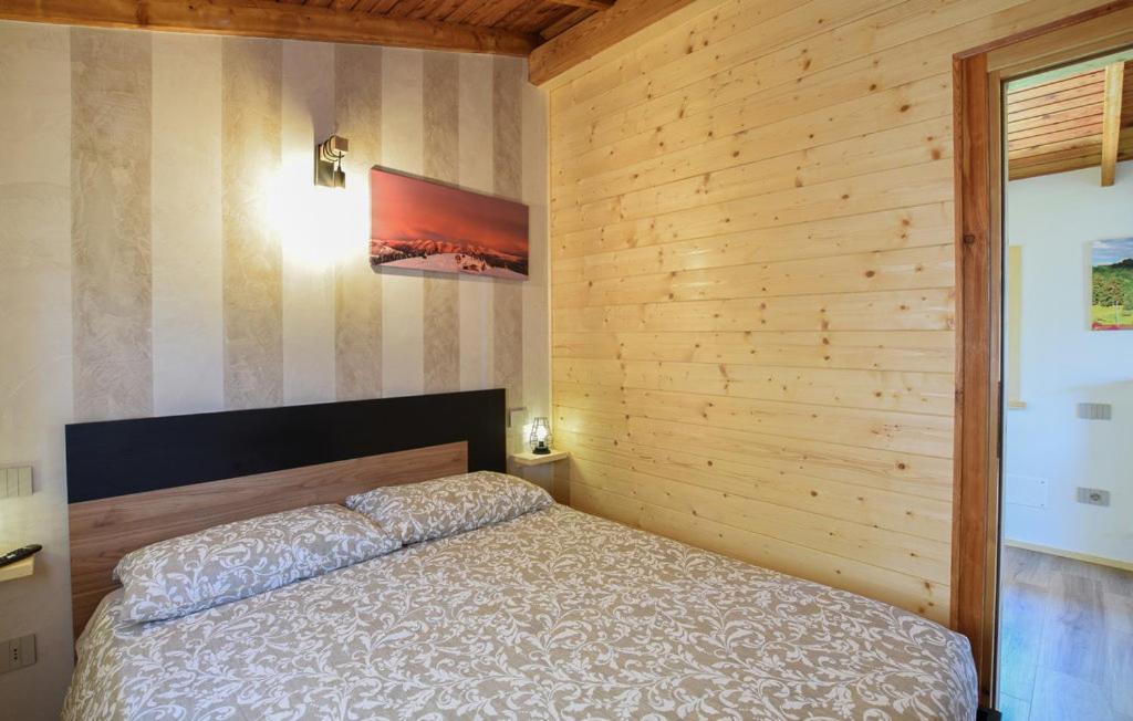 Kama o mga kama sa kuwarto sa CHALET SIMONETTA - Locanda da Tullio