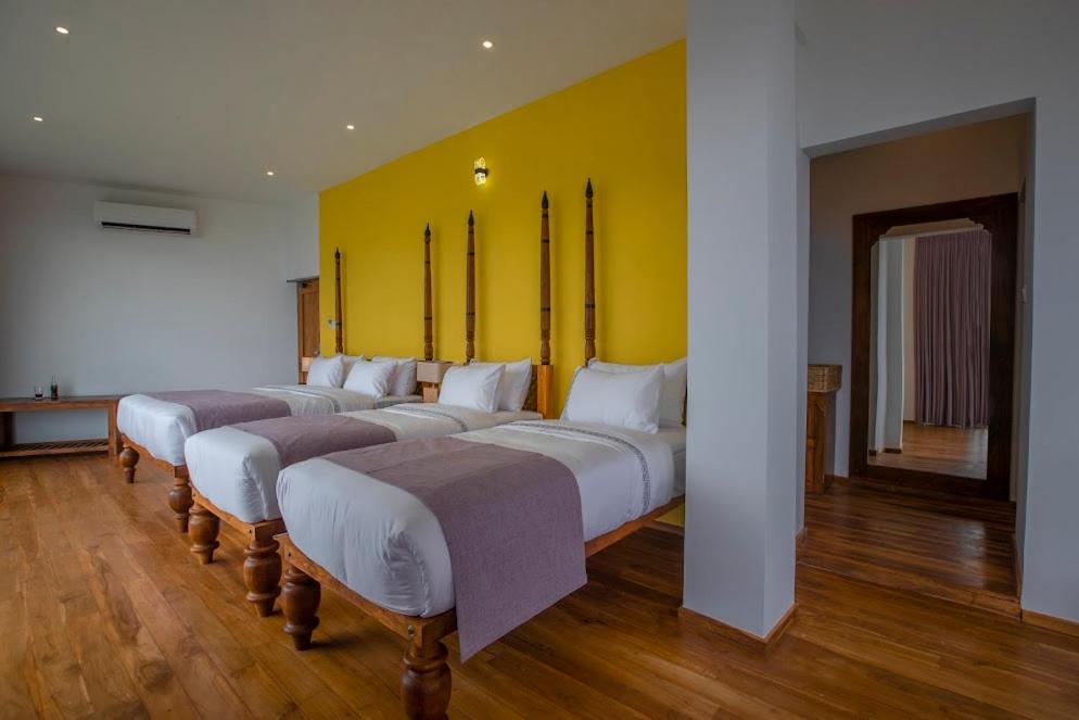 Postel nebo postele na pokoji v ubytování Morning Dew Boutique Hotel Ella