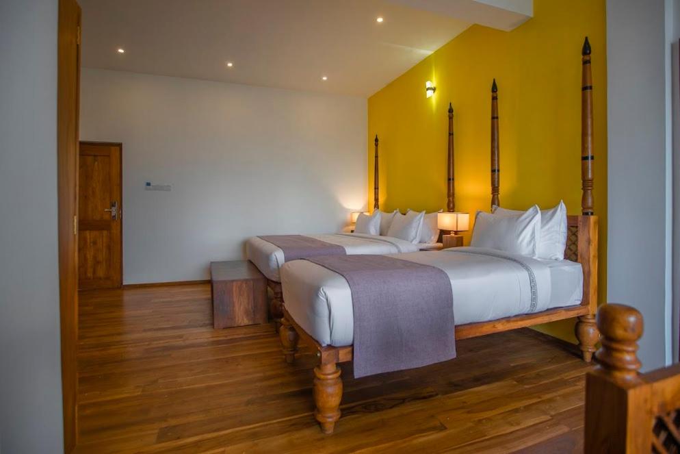Postel nebo postele na pokoji v ubytování Morning Dew Boutique Hotel Ella