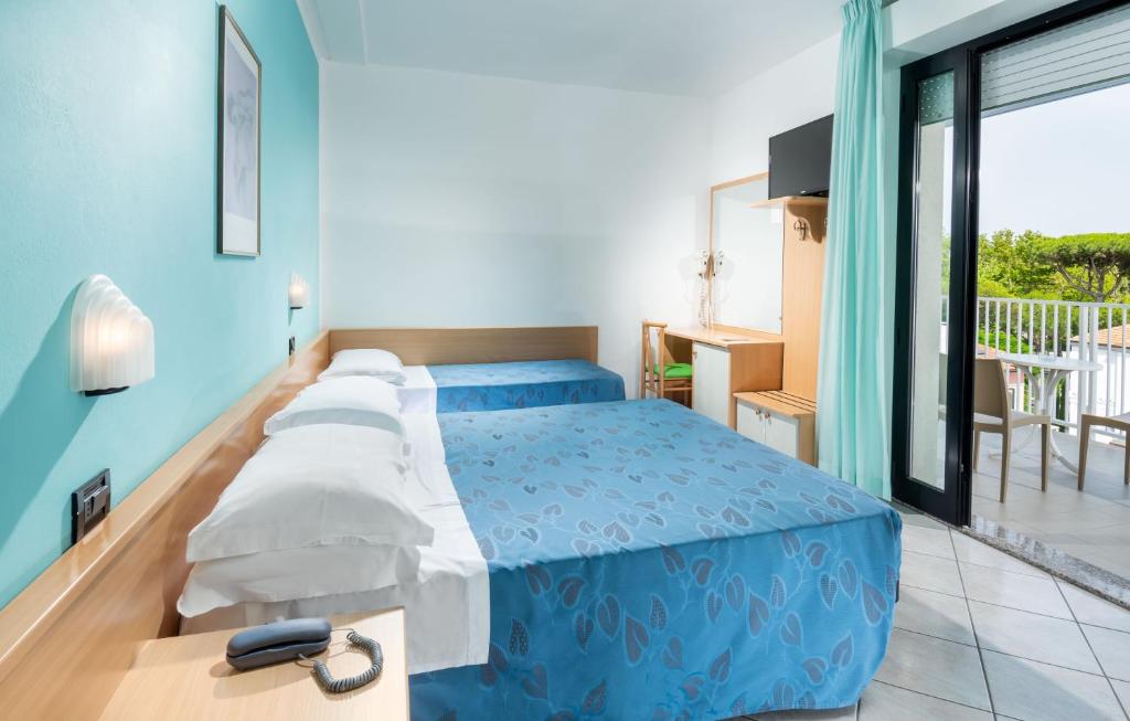 Postel nebo postele na pokoji v ubytování Hotel Odeon