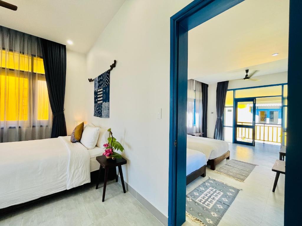 Postel nebo postele na pokoji v ubytování Chez Mimosa Hoi An - LUA Retreat
