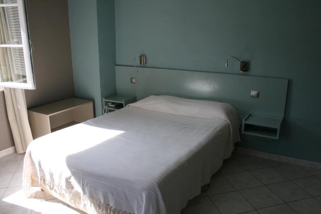 Postel nebo postele na pokoji v ubytování Le Refuge Orezza