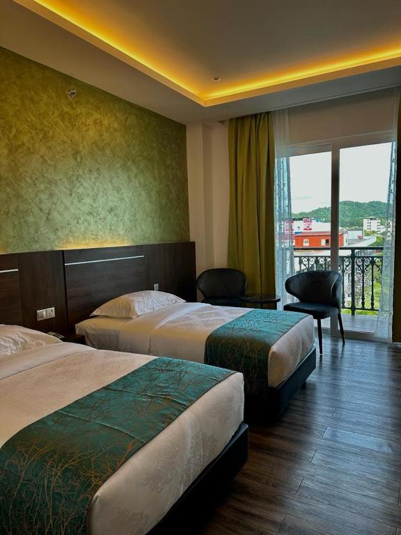 Postel nebo postele na pokoji v ubytování Malibest Resort