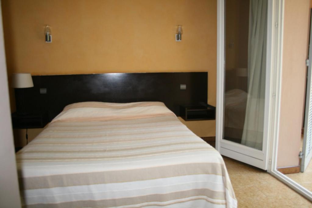 Postel nebo postele na pokoji v ubytování Le Refuge Orezza