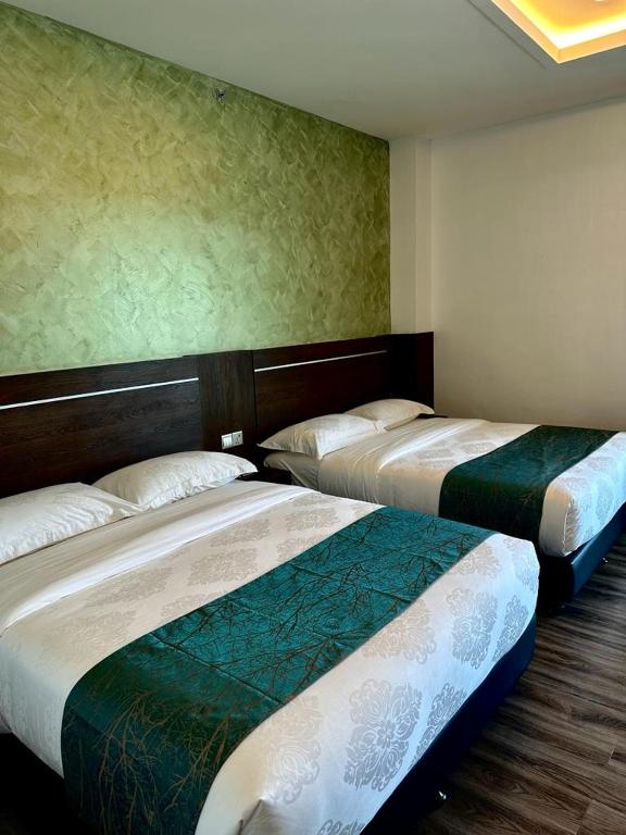 Postel nebo postele na pokoji v ubytování Malibest Resort