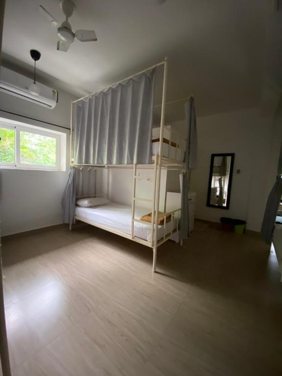 Postel nebo postele na pokoji v ubytování Hostel Mandala