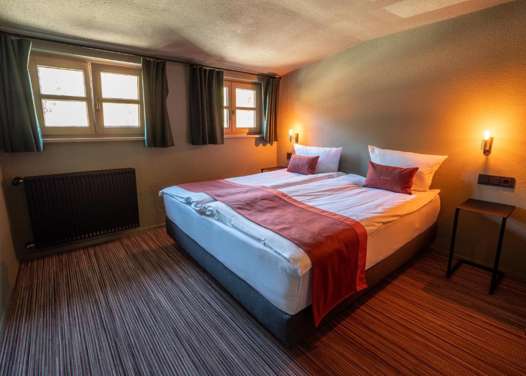 Postel nebo postele na pokoji v ubytování Berghotel Sonnenbichl