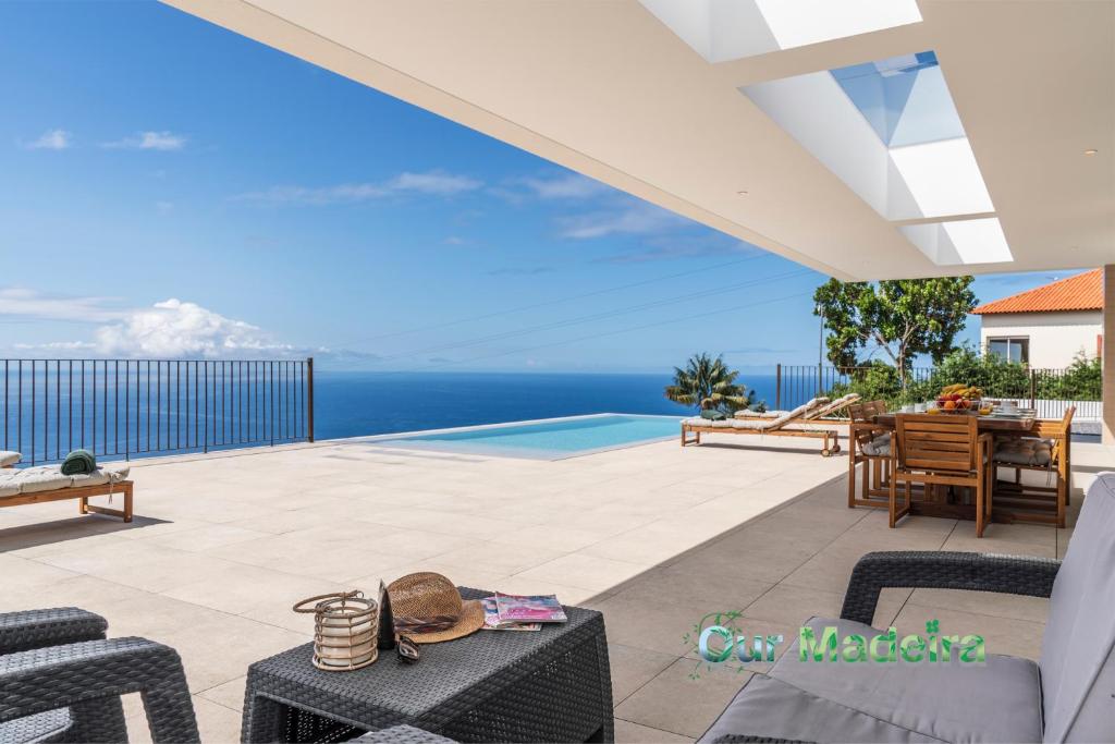 a villa with a view of the ocean at Premium villa panoramic sea-view Calheta Pearl in Estreito da Calheta