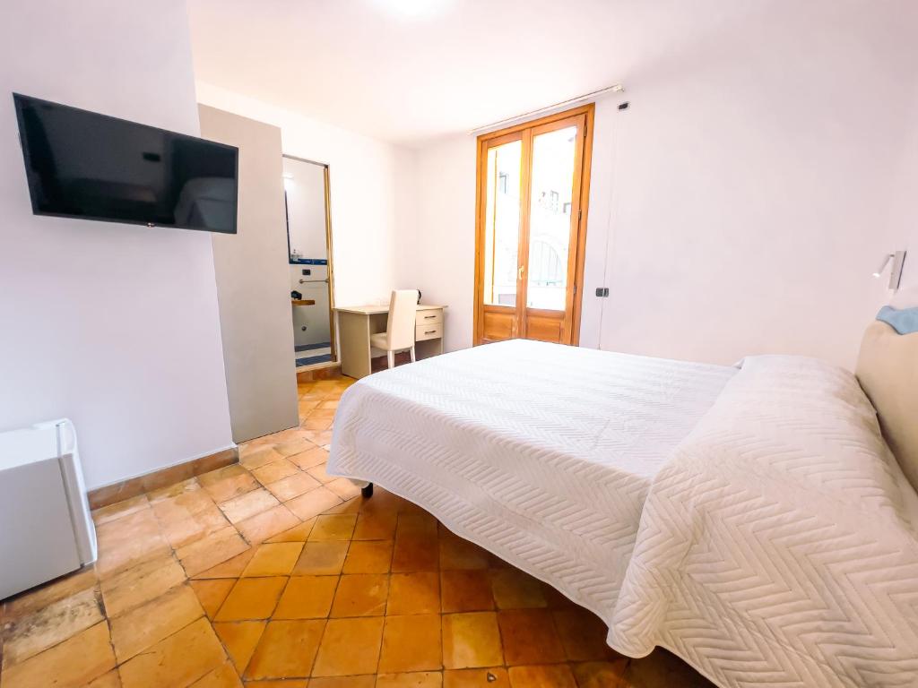 Postel nebo postele na pokoji v ubytování Residenza Ester