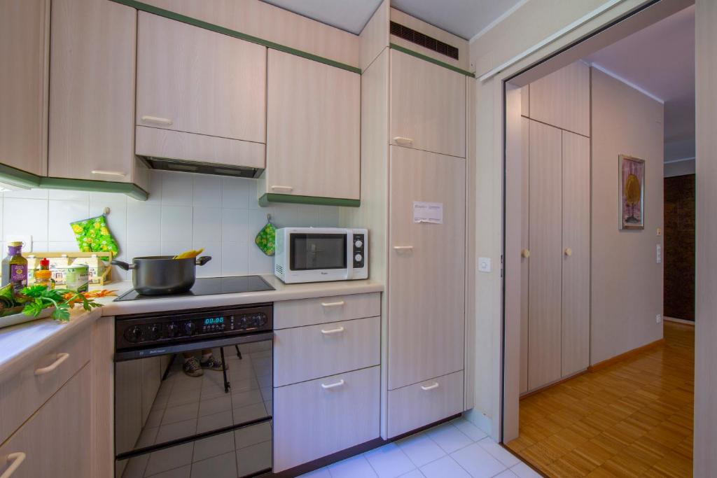 Kuchyň nebo kuchyňský kout v ubytování Maraini Elegante - Happy Rentals