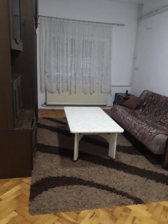 a living room with a bench and a bed at Kovcic in Tuzla