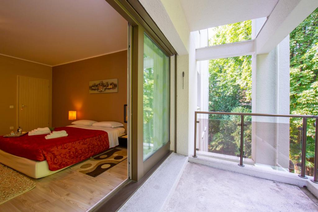 Postel nebo postele na pokoji v ubytování Maraini Elegante - Happy Rentals