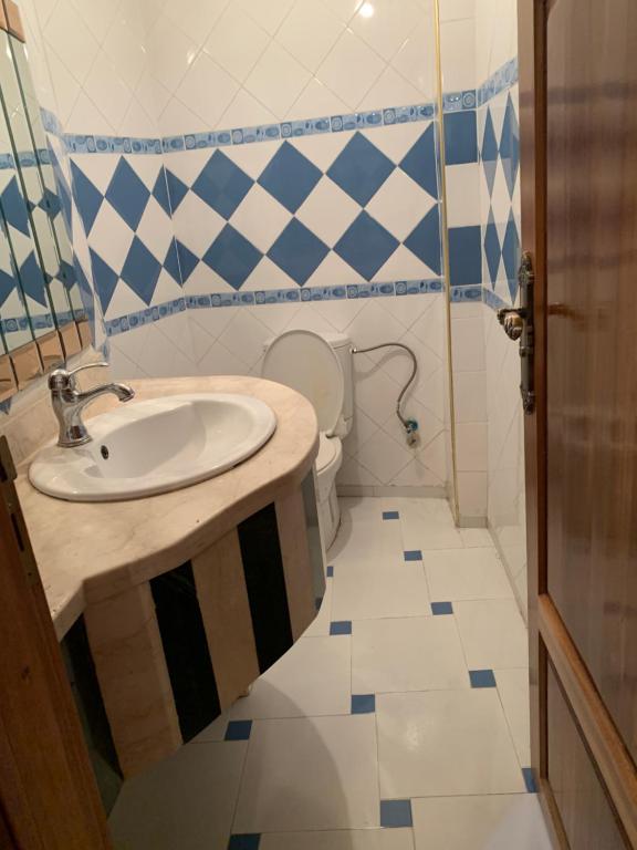 a bathroom with a sink and a toilet at Meknes hamria in Meknès