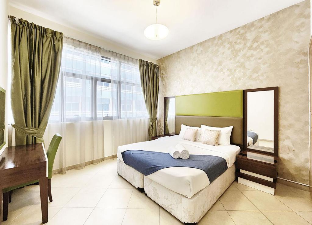 Postel nebo postele na pokoji v ubytování RH- Spacious, Stylish, 01BR near Mall of Emirates