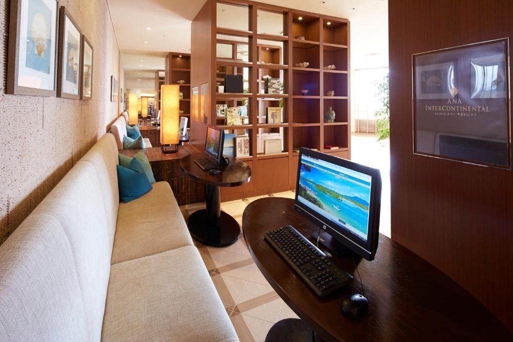 a living room with a computer on a desk at ANA InterContinental Ishigaki Resort, an IHG Hotel in Ishigaki Island