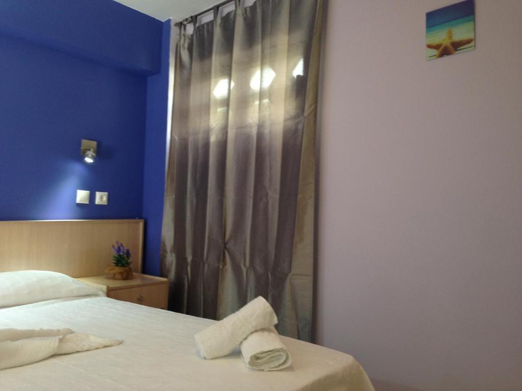 Postel nebo postele na pokoji v ubytování Zefyros Hotel