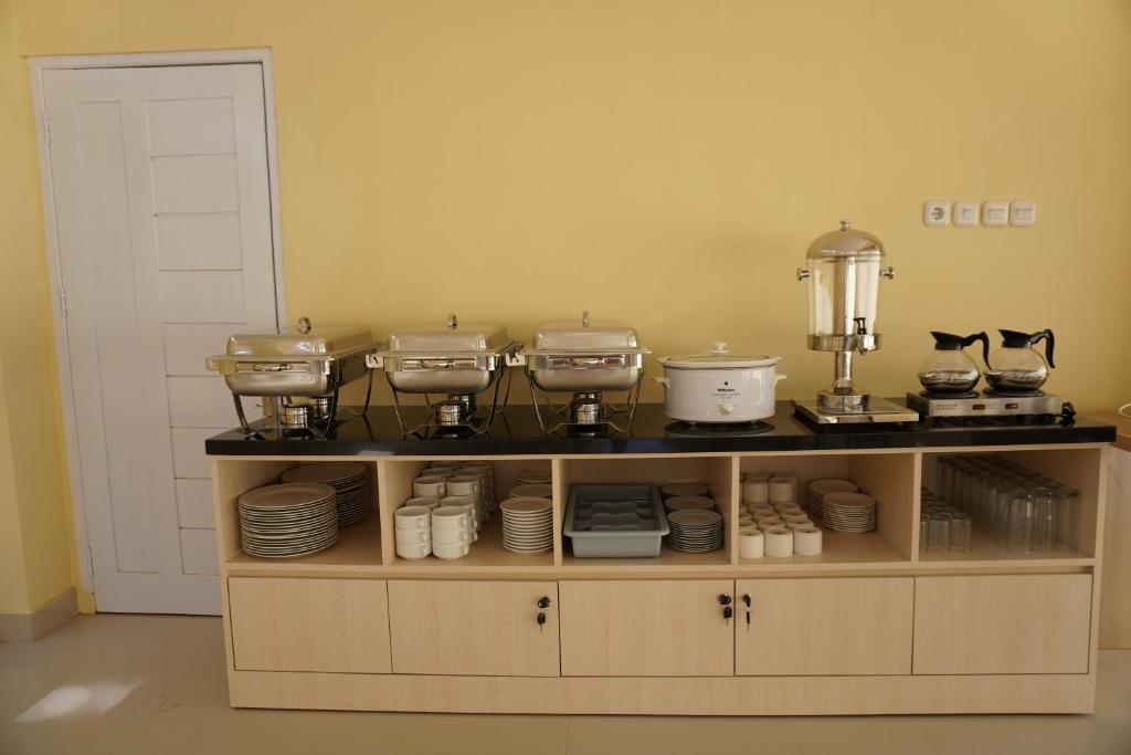 Kuchyň nebo kuchyňský kout v ubytování Hotel Luansa Klui