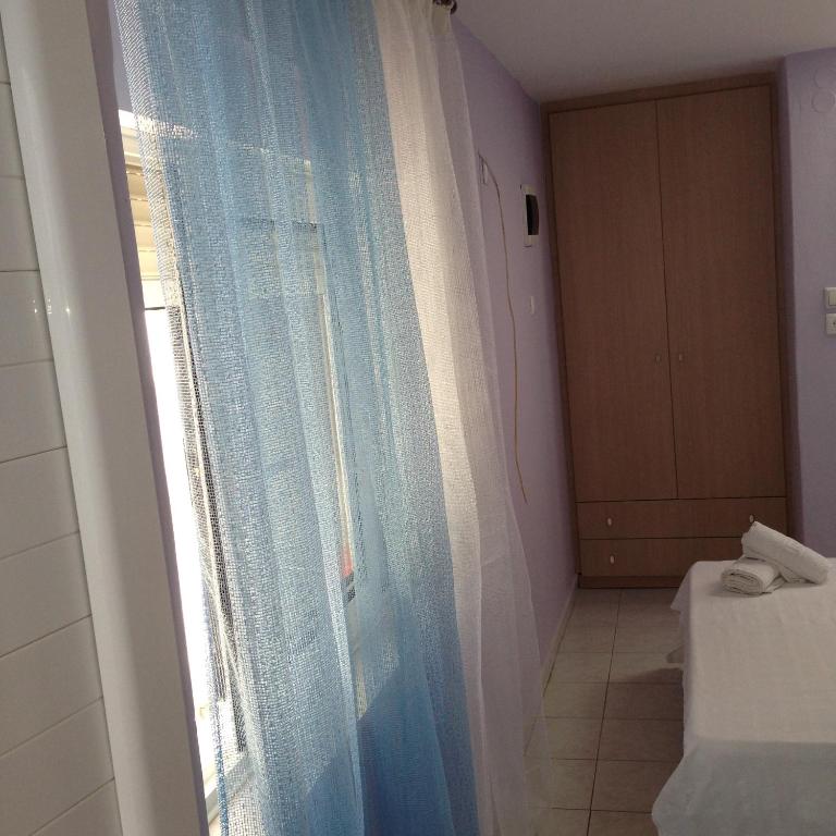 Postel nebo postele na pokoji v ubytování Zefyros Hotel