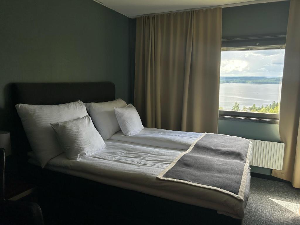 Postel nebo postele na pokoji v ubytování Hotell Wilhelmina