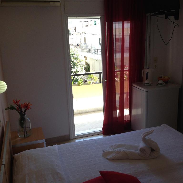 Postel nebo postele na pokoji v ubytování Zefyros Hotel