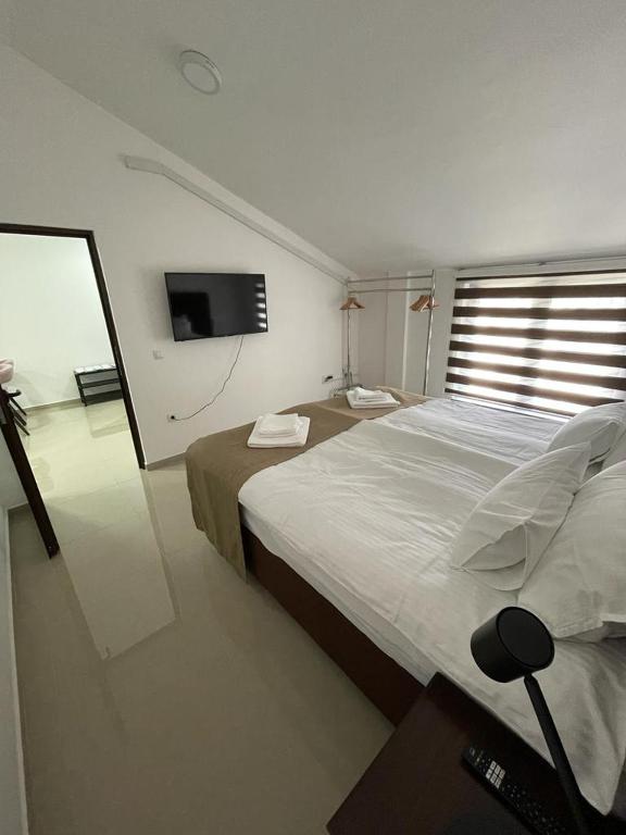 Posteľ alebo postele v izbe v ubytovaní Morpheus apartmani