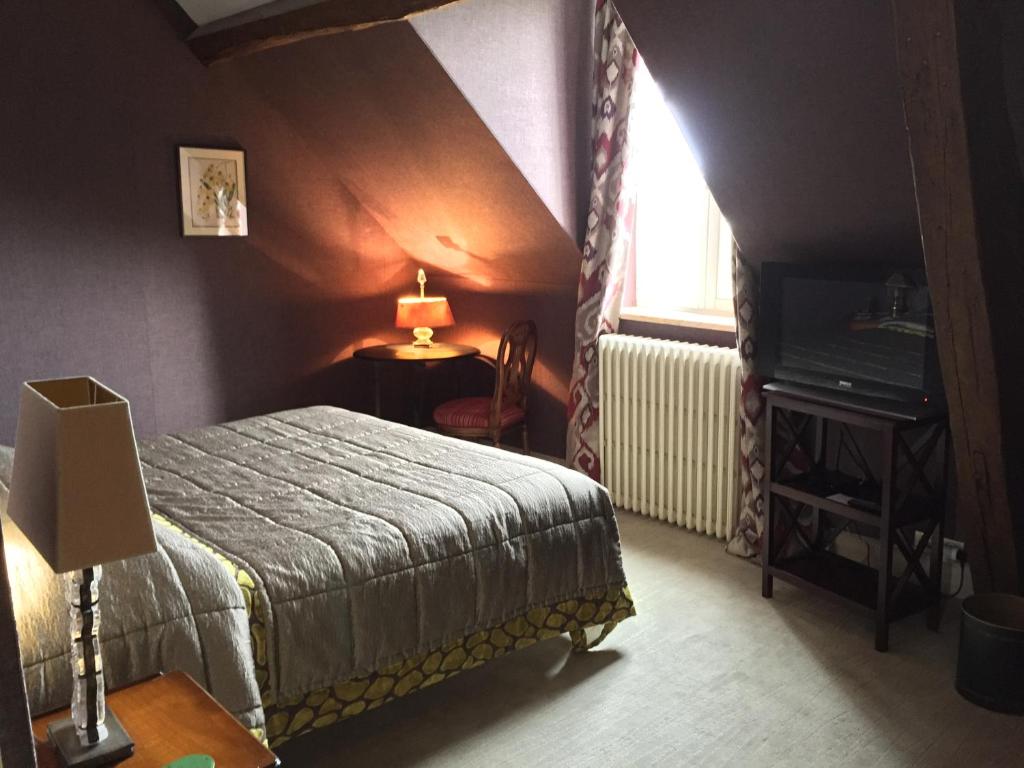 Postel nebo postele na pokoji v ubytování Chateau De Fere