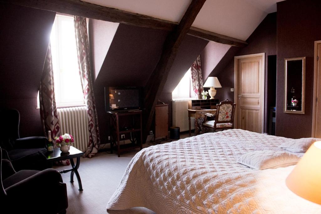Postel nebo postele na pokoji v ubytování Chateau De Fere