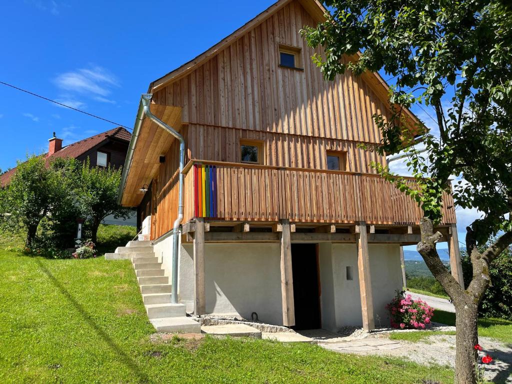 a large wooden house with a garage at KRASTHAUS in Oberhaag