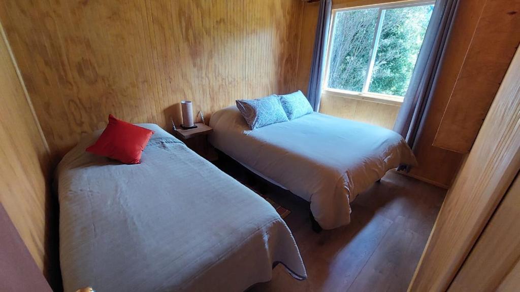 Postel nebo postele na pokoji v ubytování Cabañas & Habitaciones Del Alto