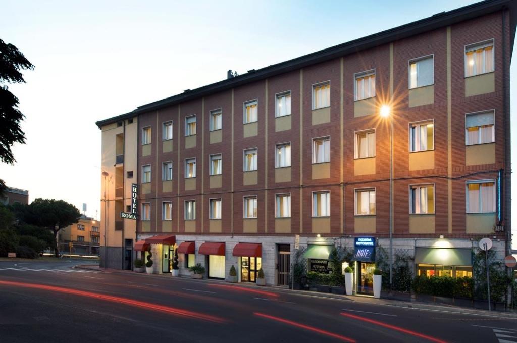 a building on the side of a street at Hotel Roma in Ravenna