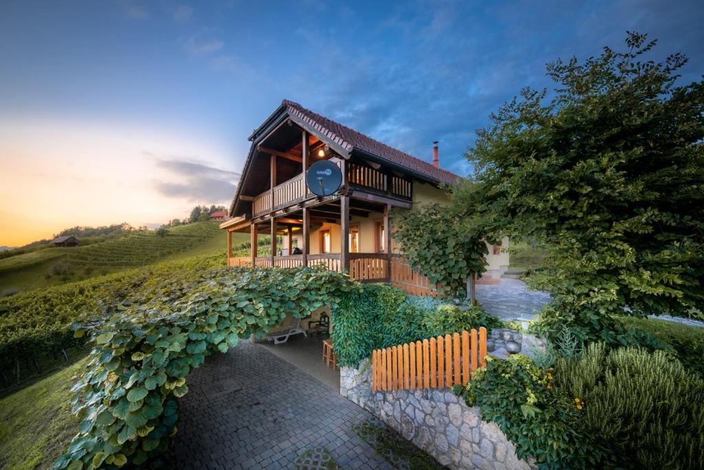 a house on top of a hill with a stone walkway at Holiday Home Mirt with HotTub & Sauna in Blanca