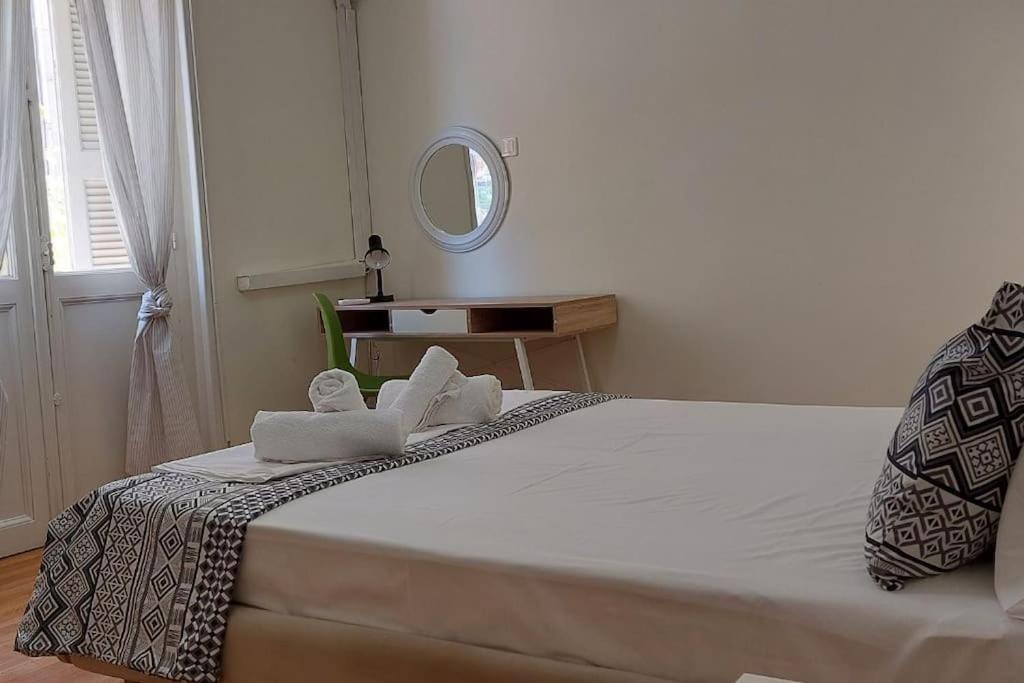 A bed or beds in a room at Fokionos Athens Centre 5 BD, 1,5 BATH