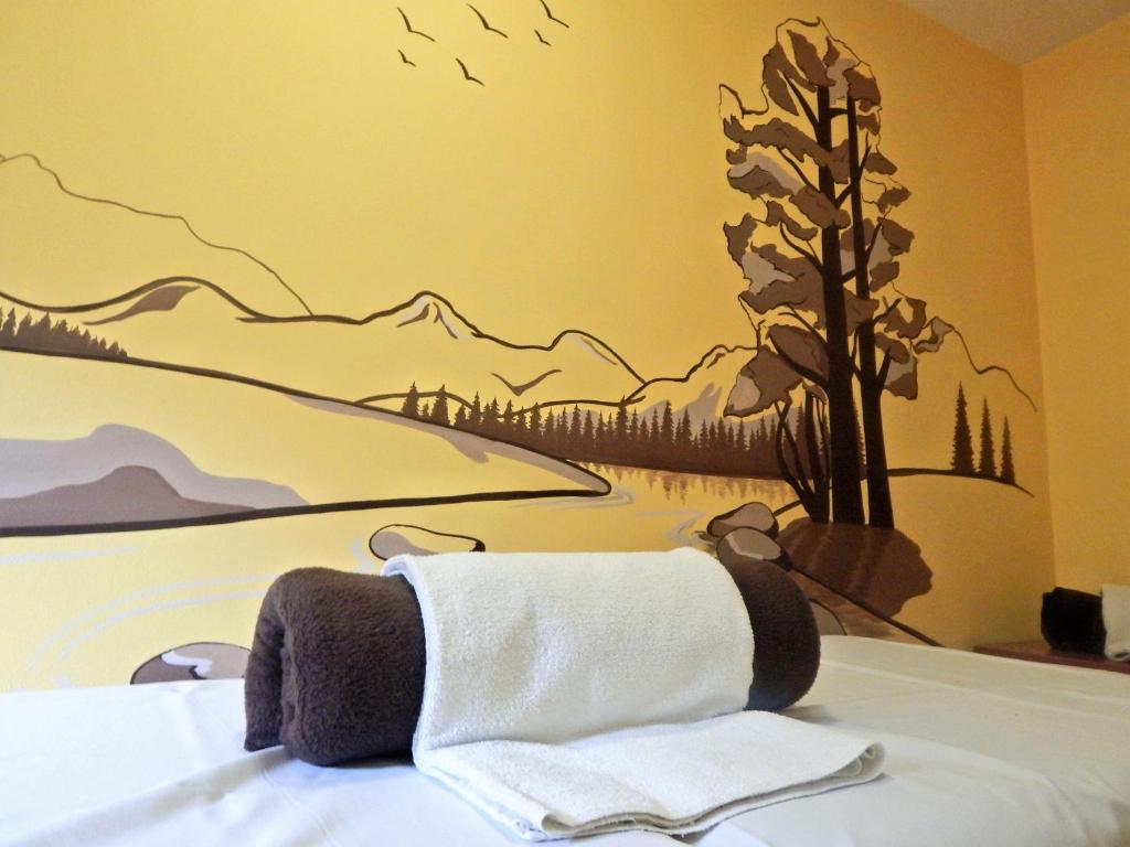 Postel nebo postele na pokoji v ubytování Hotel Bystrina