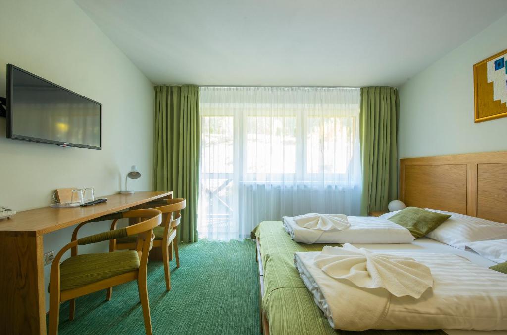 Postel nebo postele na pokoji v ubytování Hotel Bystrina