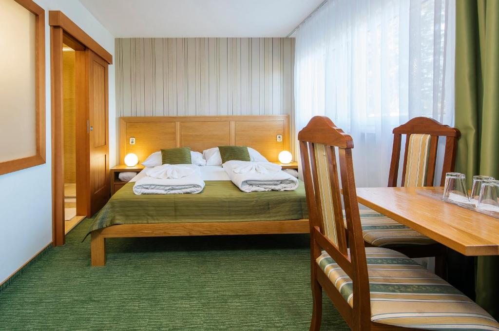 Postel nebo postele na pokoji v ubytování Hotel Bystrina