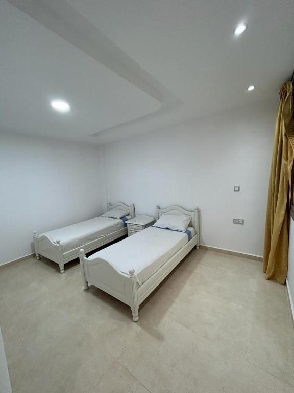 Postel nebo postele na pokoji v ubytování O' appartement Alhoceima