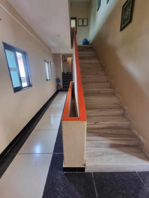 an empty hallway with a staircase in a building at Dream Vision Guest House in Diu