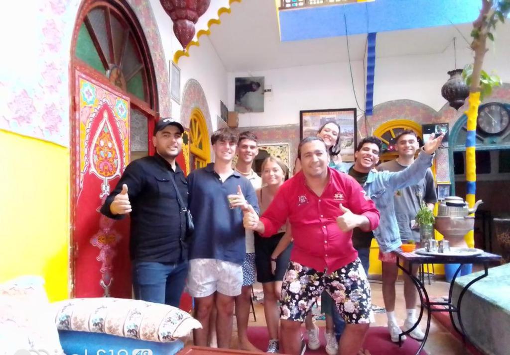 a group of people posing for a picture in a room at Riad Dia in Marrakesh