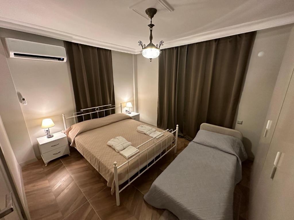 Postel nebo postele na pokoji v ubytování Side Holiday House